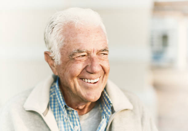 istock Handsome senior man smiles in delight 1158239181