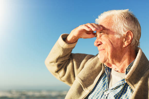 Active old man outdoors at the coast.