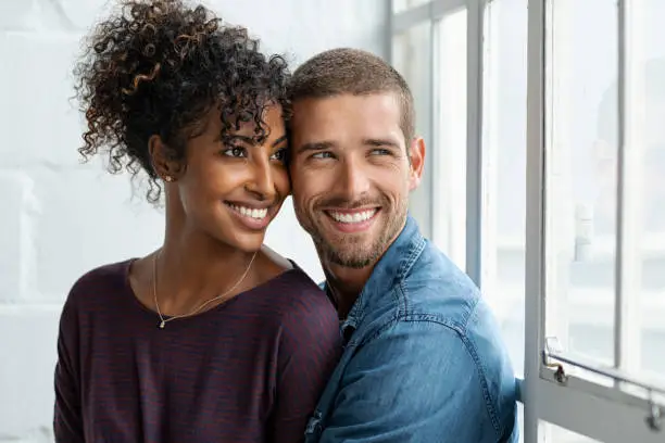 Photo of Loving multiethnic couple thinking