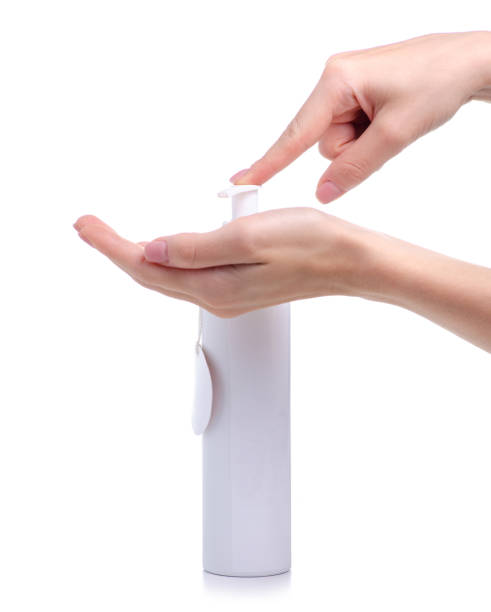 istock White bottle with dispenser beauty product in hand 1158245393