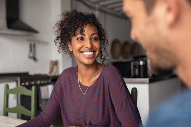 istock Cheerful young african woman with man 1158246790