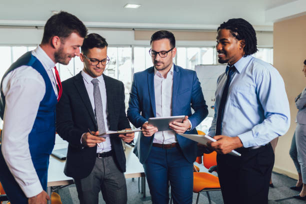 istock Young and successful business team in office. 1158247056