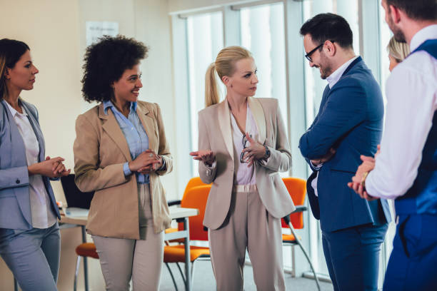istock Business team having a meeting standing in the office 1158247257