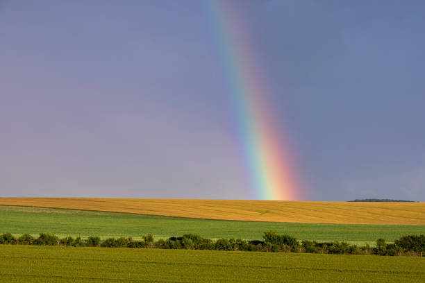 istock rainbow over a beautiful countryside landscape 1158247297