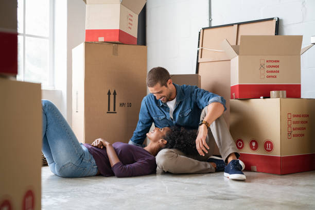 Woman lying on man lap after moving house