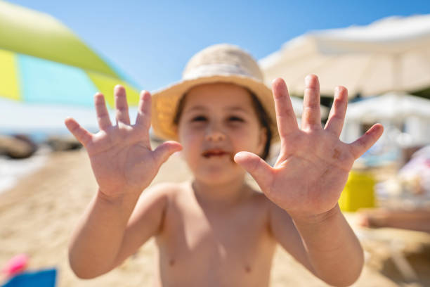 istock Little girl showing off her messy hands 1158247986