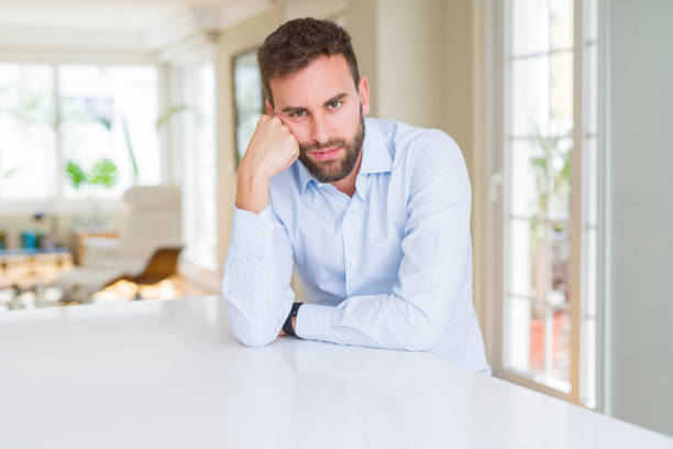 istock Handsome business man thinking looking tired and bored with depression problems with crossed arms. 1158248254