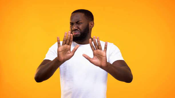 displeased young black guy showing rejection gesture, negative attitude, refuse - offense imagens e fotografias de stock