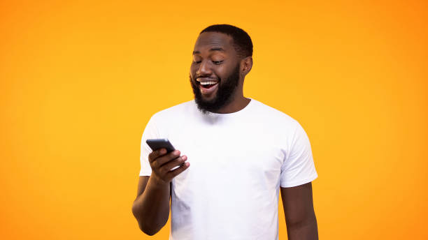 istock Amazed african man browsing smartphone internet, online application, cash back 1158248872