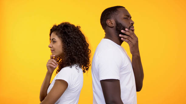 istock Thoughtful male and female standing back, thinking about acquaintance, choice 1158248929
