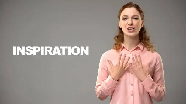 Woman saying inspiration in sign language, text on background, communication