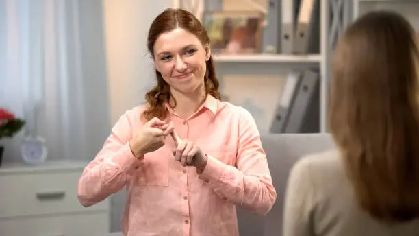 Deaf woman saying you are my best friend, sign language communication, gesture