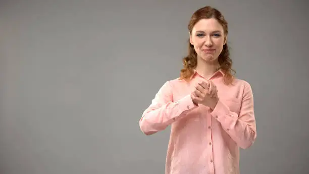 Lady saying believe in sign language, showing words in asl lesson, communication