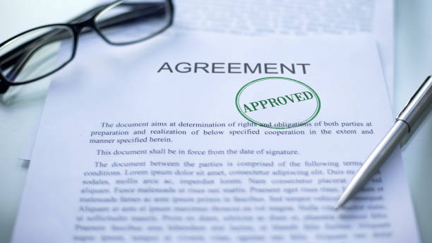 istock Agreement approved, seal stamped on official document, business contract closeup 1158250010