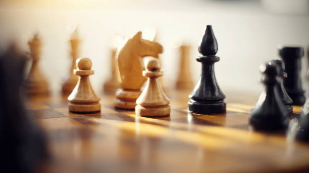 istock Wooden chess pieces on the chessboard. 1158250887