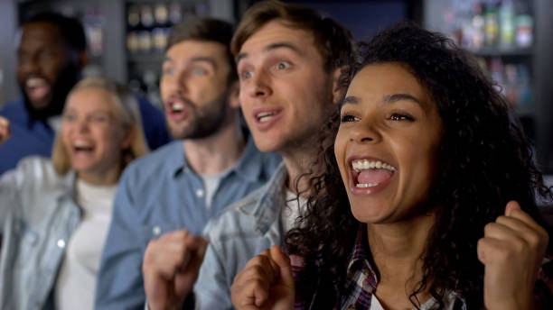 istock Group of young people rooting for team, national league support, event audience 1158250911