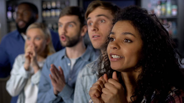 istock Excited friends watching national competition on tv, supporting favorite team 1158250954