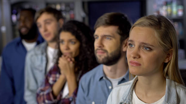 istock Upset team supporters watching championship online, rooting for goal competition 1158250962