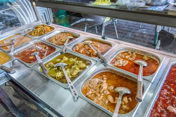 Eastern spiced Meat dishes on the trays ready to serve.\nFordsburg is an old historical area where mainly indian, turkish, pakistani and other east asian cultures coexist with restaurants and spice dealers.