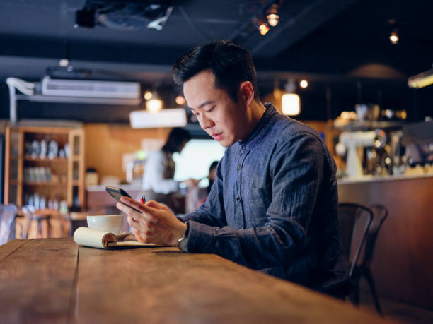 istock Young Professional Man Working in a Small Coffee Shop 1158252243