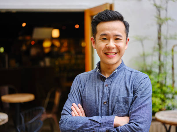 istock Young Professional Man Working in a Small Coffee Shop 1158252443