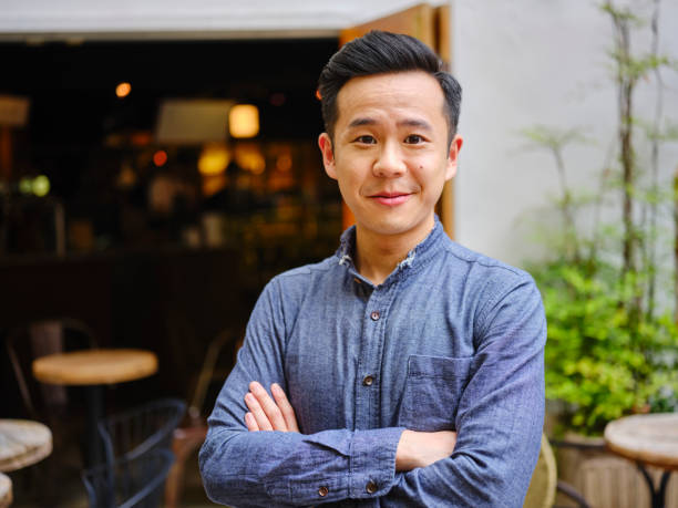 istock Young Professional Man Working in a Small Coffee Shop 1158253027