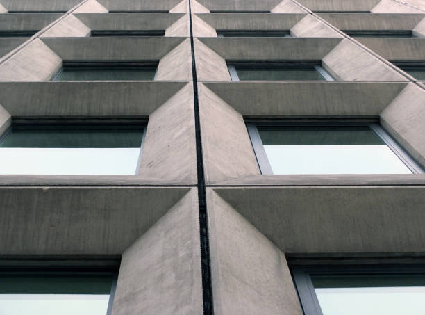 istock perspective view of geometric angular concrete windows on the facade of a modernist 1960s brutalist style building 1158255264