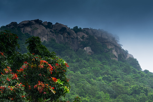 MathaBuru Paharh is part of Ajodhya hill of Purulia., West Bengal, India. The beautiful rocks are rain soaked , with blue monsoon sky in the background signalling rain is approaching. Monsoon season.