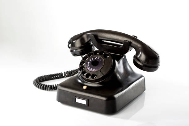 istock Old telephone w48 antique black on white background 1158256702