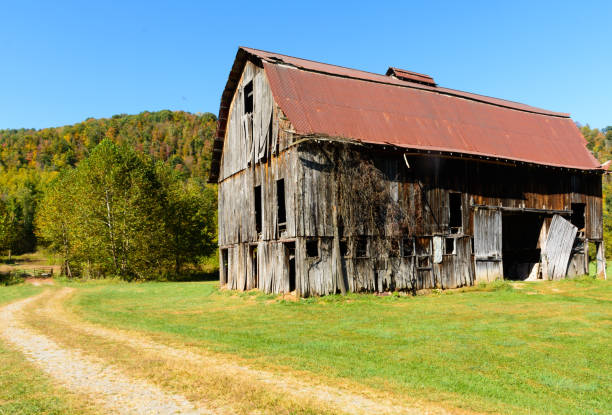 istock Old barn along gravel road 1158257052