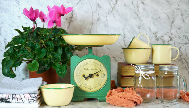 istock Vintage kitchen scale decor with farmhouse style kitchenware. 1158259918