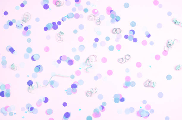 istock Pink background with purple confetti and silver curls. 1158260112