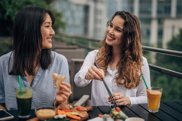 istock Friends eating healthy lunch 1158262162