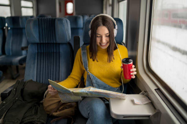 istock Young woman traveling by train 1158262503