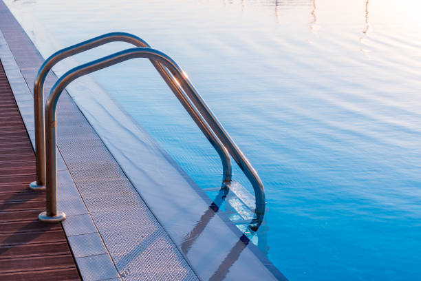 istock Swimming pool in curved shape with stairs 1158266691