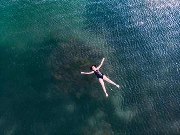 istock Girl Doing Star Movement at Sea 1158272014