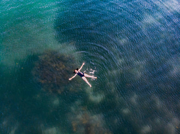 istock Girl Doing Star Movement at Sea 1158272015