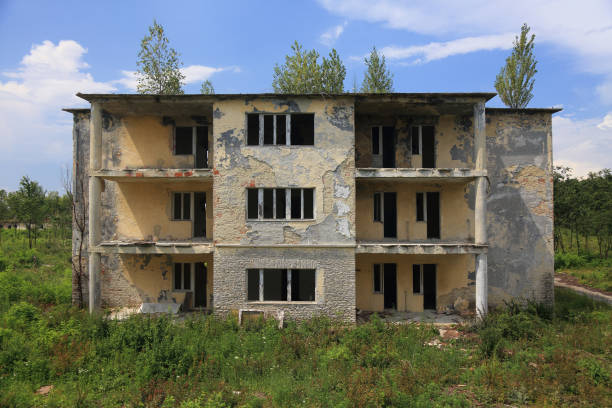 old building with broken windows and doors
