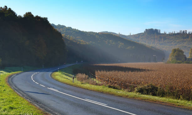 istock Bending road among hills in autumn 1158273588