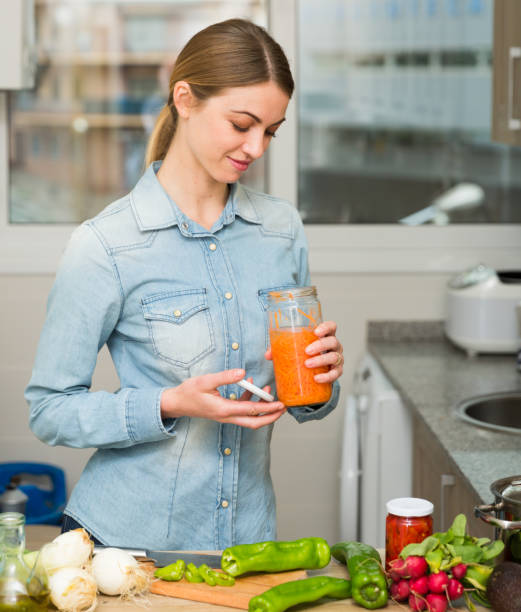 istock Woman cooking with pickled carrot 1158274591