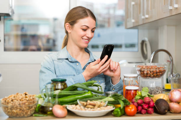 istock Young woman with smartphone 1158274597