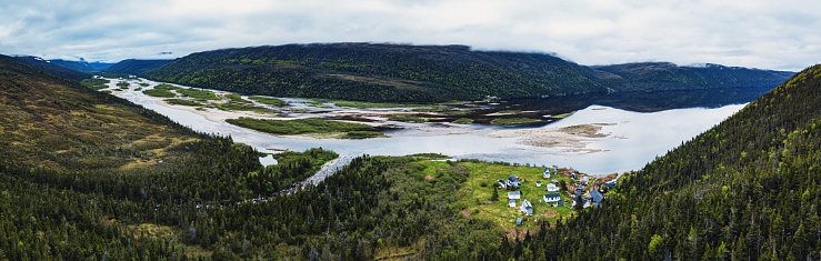 Aerial panoramic view of the tiny, seasonal village of North Bay located at the mouth of the LaPoile River.