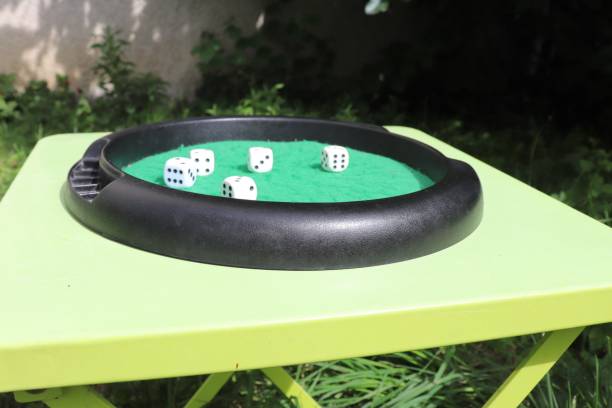 istock Yams game - Dice game on a green carpet 1158276871