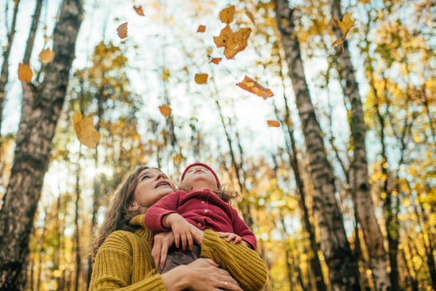 Family enjoying autumn in park