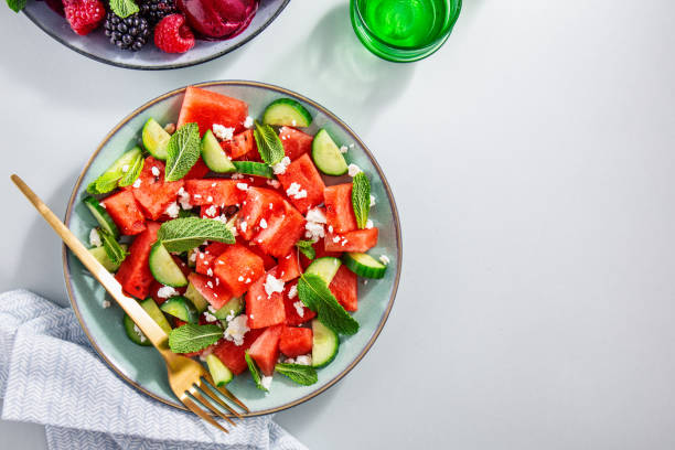 istock Summer salads with watermelon and cucumbers, berries and ice cream 1158288528