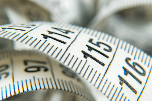 istock White measure tapes take of macro shot 1158290142