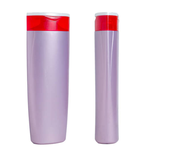 istock Blank purple plastic isolated bottle. Packaging for shampoo, cosmetic. Front and side view. 1158292057