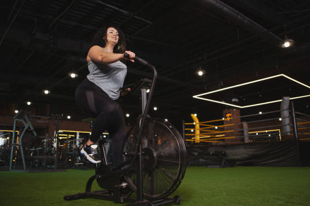 istock Lovely plus size woman exercising at the gym 1158294020