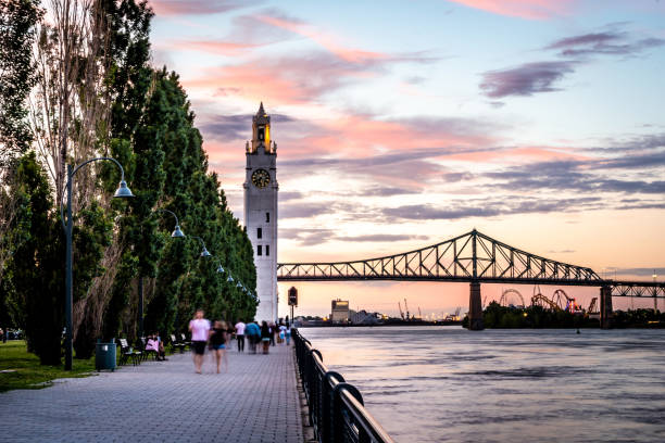 Montreal city at sunset. Montreal's old port at sunset with the clock tower and Jacques Cartier bridge in background. montreal stock pictures, royalty-free photos & images