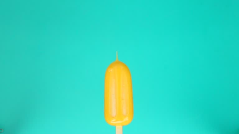 Melting ice cream slow motion on color background